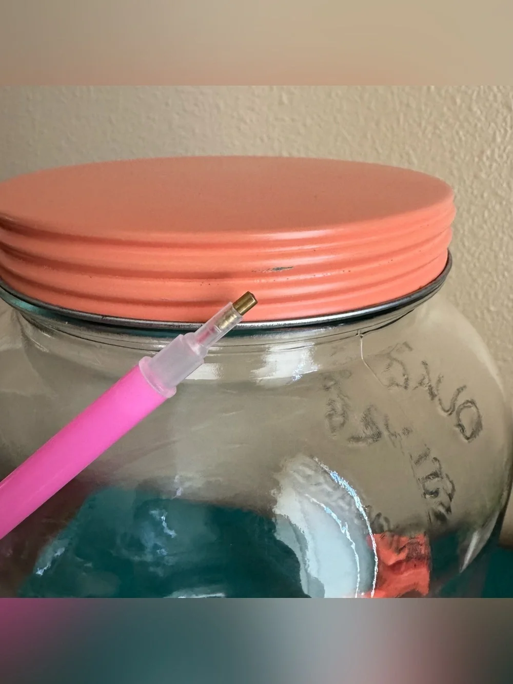Quality Drinkware large beverage dispenser with salmon pink/peach lid